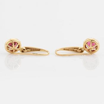 Pink tourmaline and brilliant cut diamond earrings.