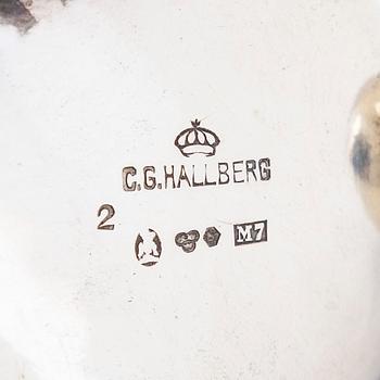 A pair of silver salt and mustard tankard,  C.G. Hallberg, Stockholm 1911 and 1914.