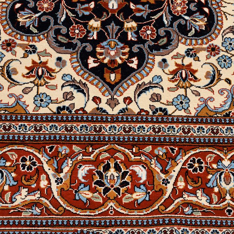 A Ghom rug, 222 x 146 cm.