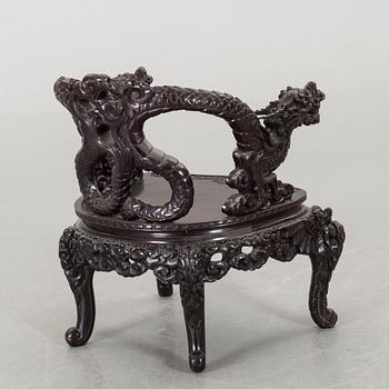 A Chinese 20th century wooden armchair.