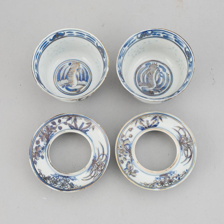 A pair of blue and white cups with stands, late Qing dynasty.