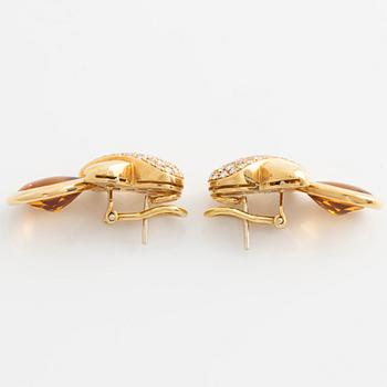 Earrings with pear-shaped citrines and brilliant-cut diamonds.