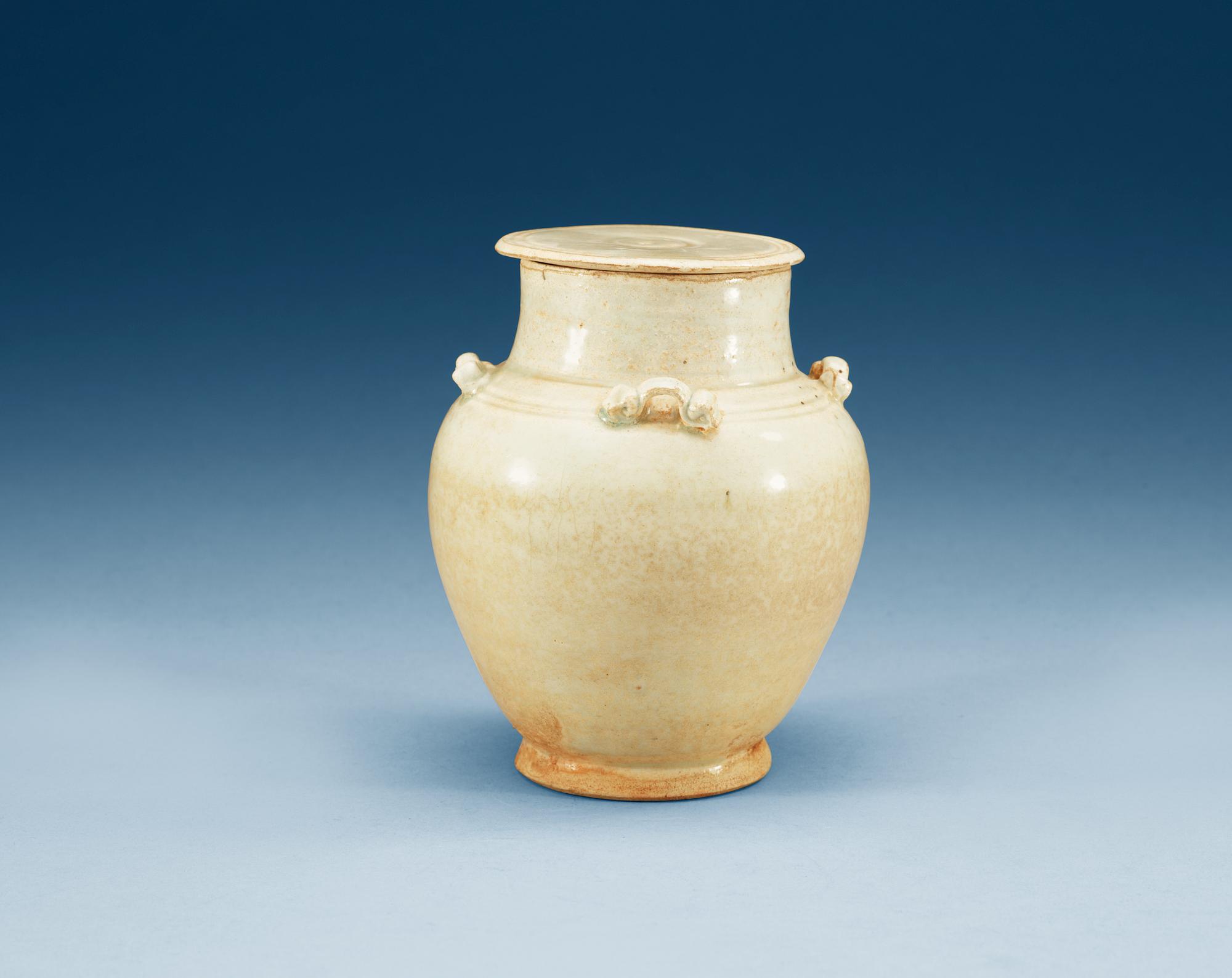 A pale green glazed jar with cover, Song dynasty (960-1279).