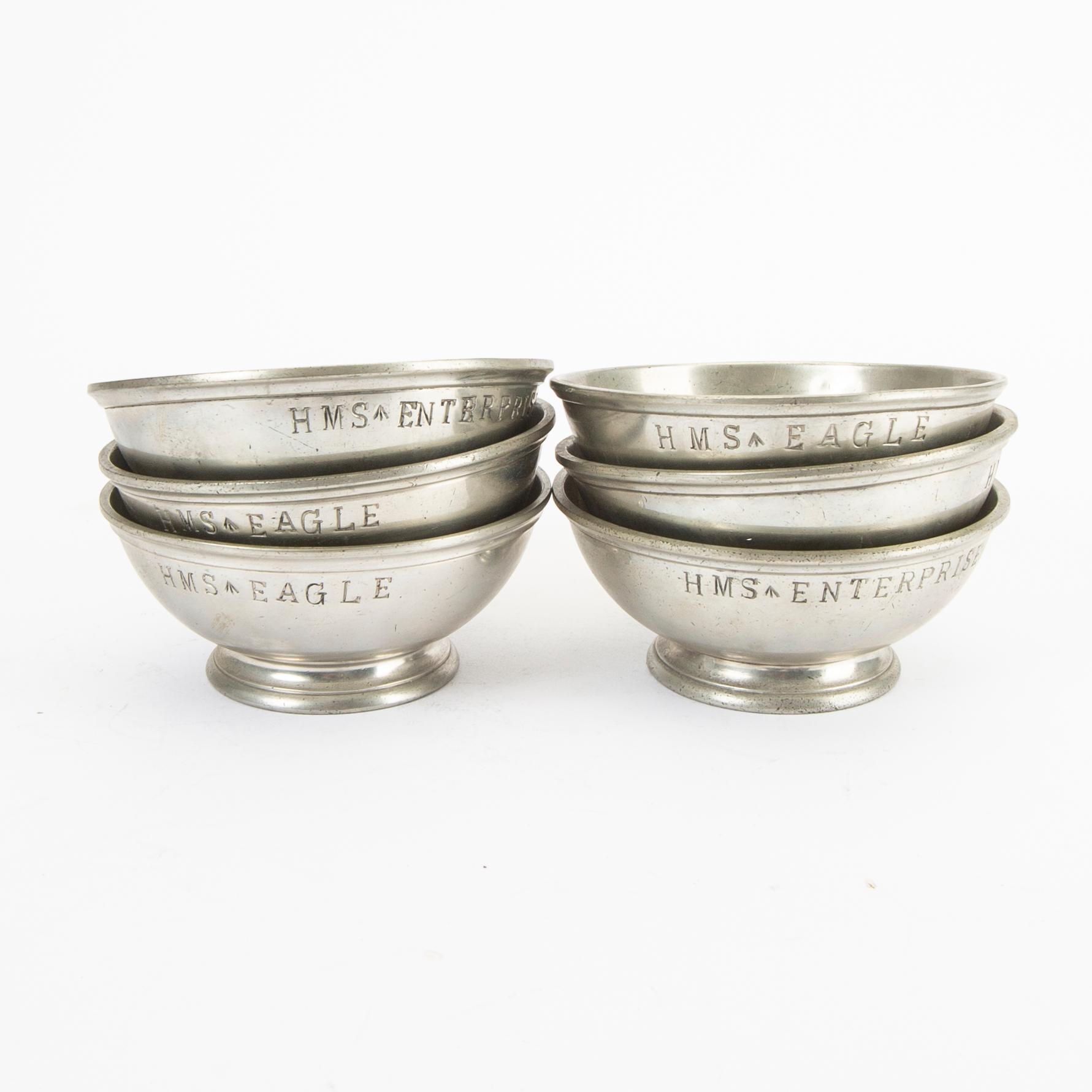 A set of five pewter tankards and six bowls England 20th century.