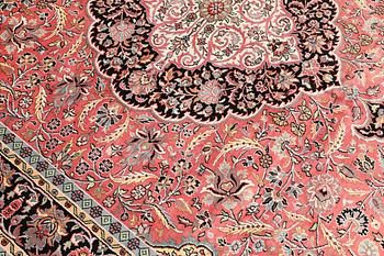 A Kashmir silk carpet, approx. 305 x 216 cm.