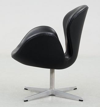 A Arne Jacobsen black leather "Swan" easy chair, Fritz Hansen, Denmark 2001.