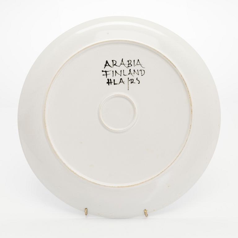 Hilkka-Liisa Ahola, a ceramic serving dish and ten side plates, signed HLA, Arabia Finland.