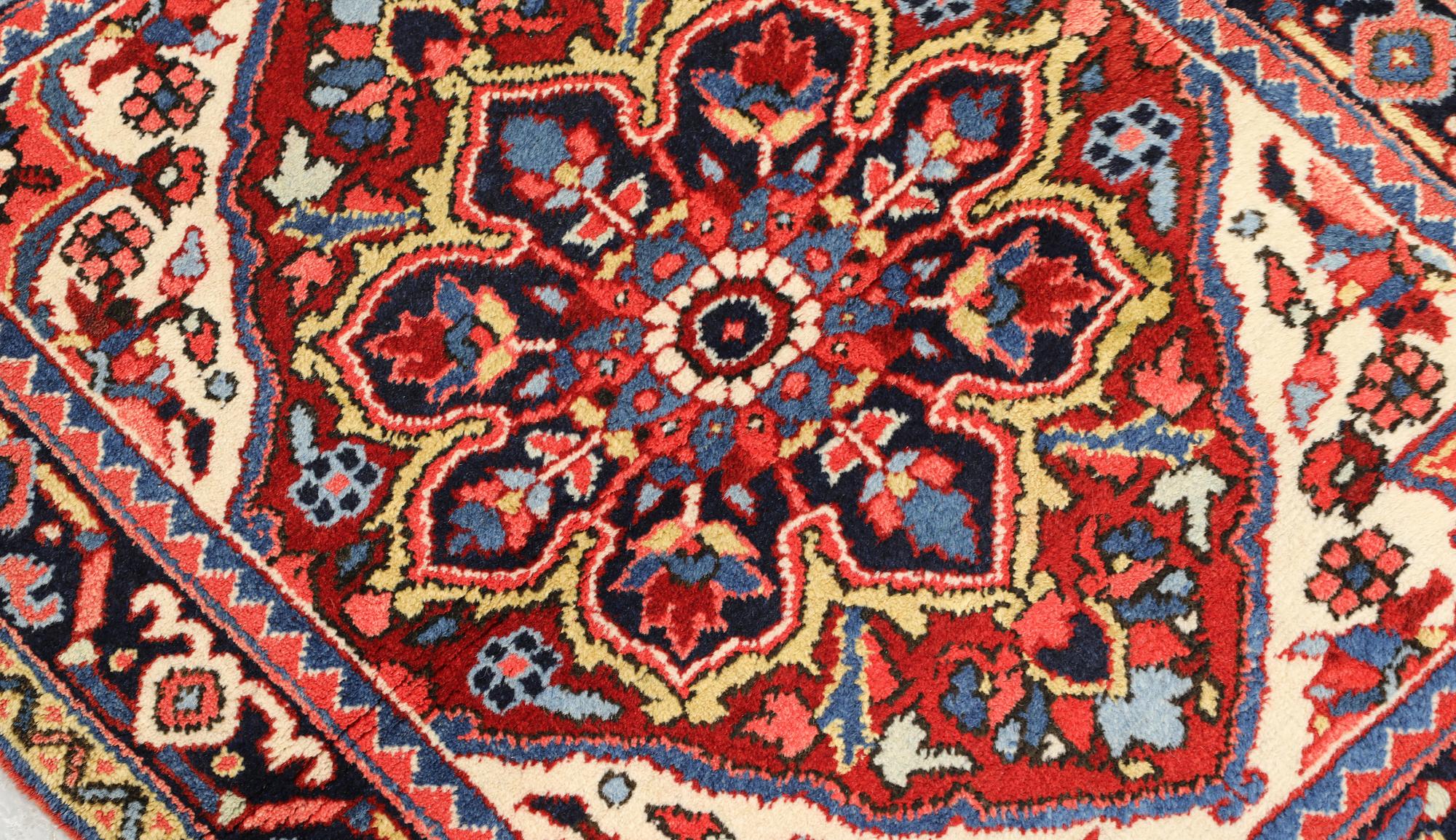 A semi-antique Heris rug, approx. 90 x 78 cm.