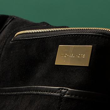 A hand bag by Michel Kors.