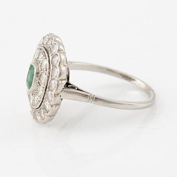 Platinum ring with an emerald and brilliant-cut diamonds.