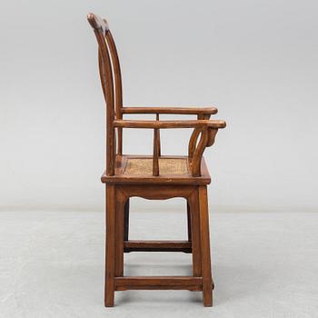 A Chinese wooden armchair, 20th century.