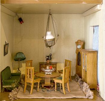 A doll house with interior including Nolbyn and Nordiska Kompaniet first half of the 20th century.