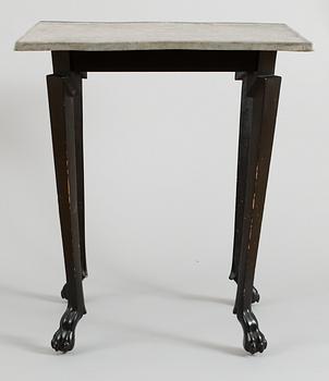 595. An Anna Petrus table, Stockholm circa 1922; pewter top and black wooden legs.