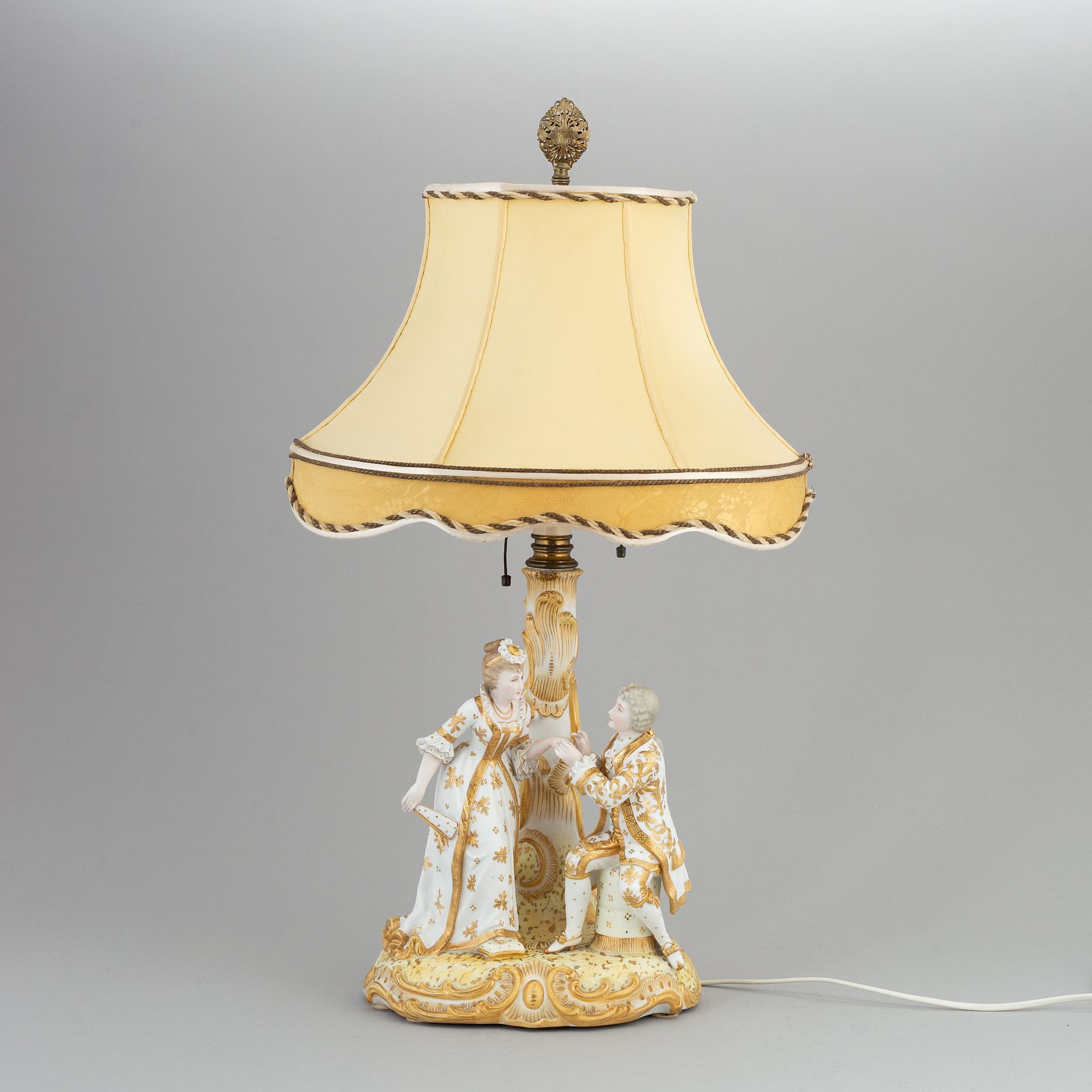 a rococo-style porcelain table lamp from the first half of the 20th century.