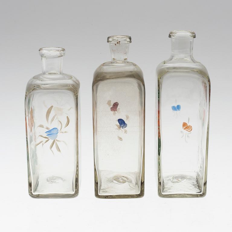 THREE 19TH CENTURY GLASS SPIRIT DECANTERS.