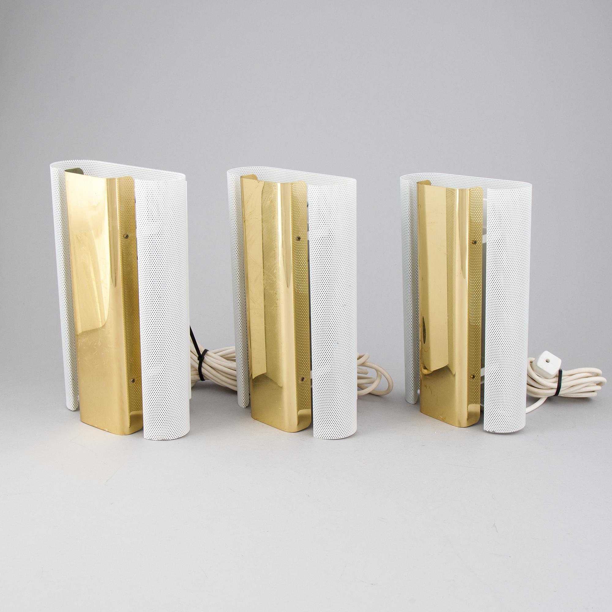 Hans-Agne Jakobsson, a set of three of 'V-451/18L'/'Rasputin' brass wall lights from Markaryd.