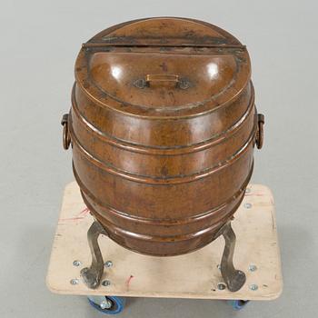 A copper water container, around the year 1900.