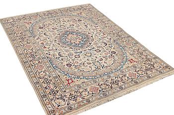 A Nain carpet, part silk, 9 laa, c. 300 x 195 cm.
