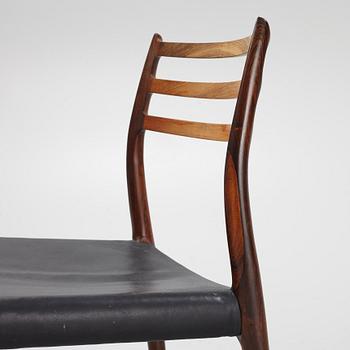 Niles Otto Møller, a rosewood veneered table with four chairs, JL Møller, Denmark, 1950's/60's.