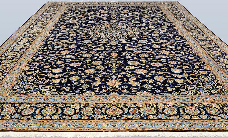 A Keshan carpet, signed, approx. 600 x 400 cm.