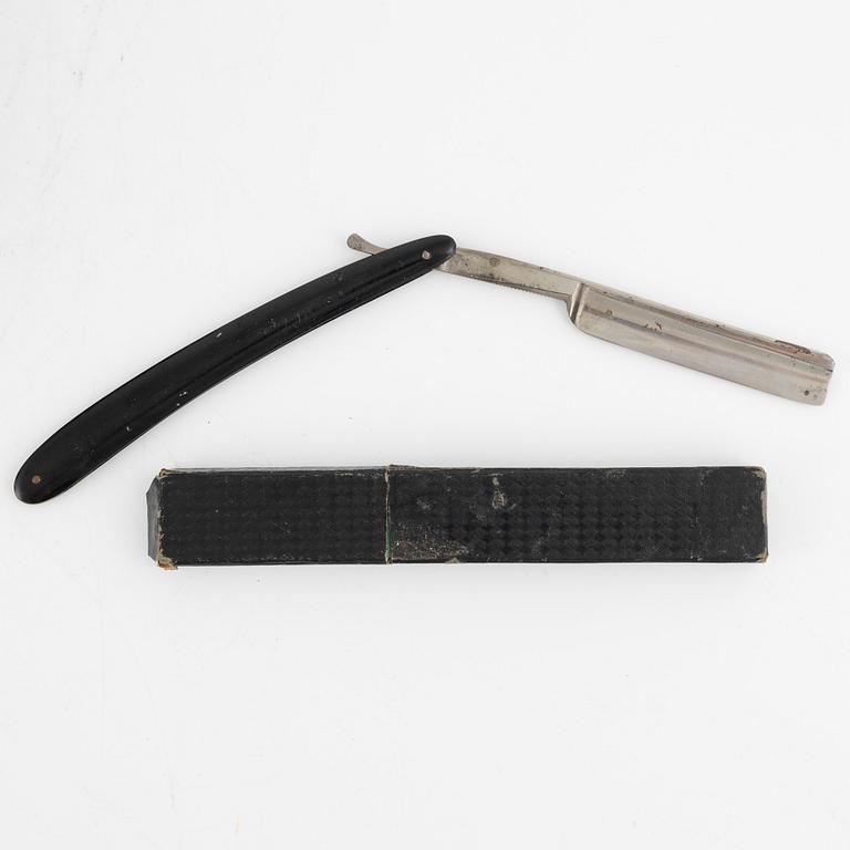 An early 19th century mahogny-veneered box for shaving utensils.