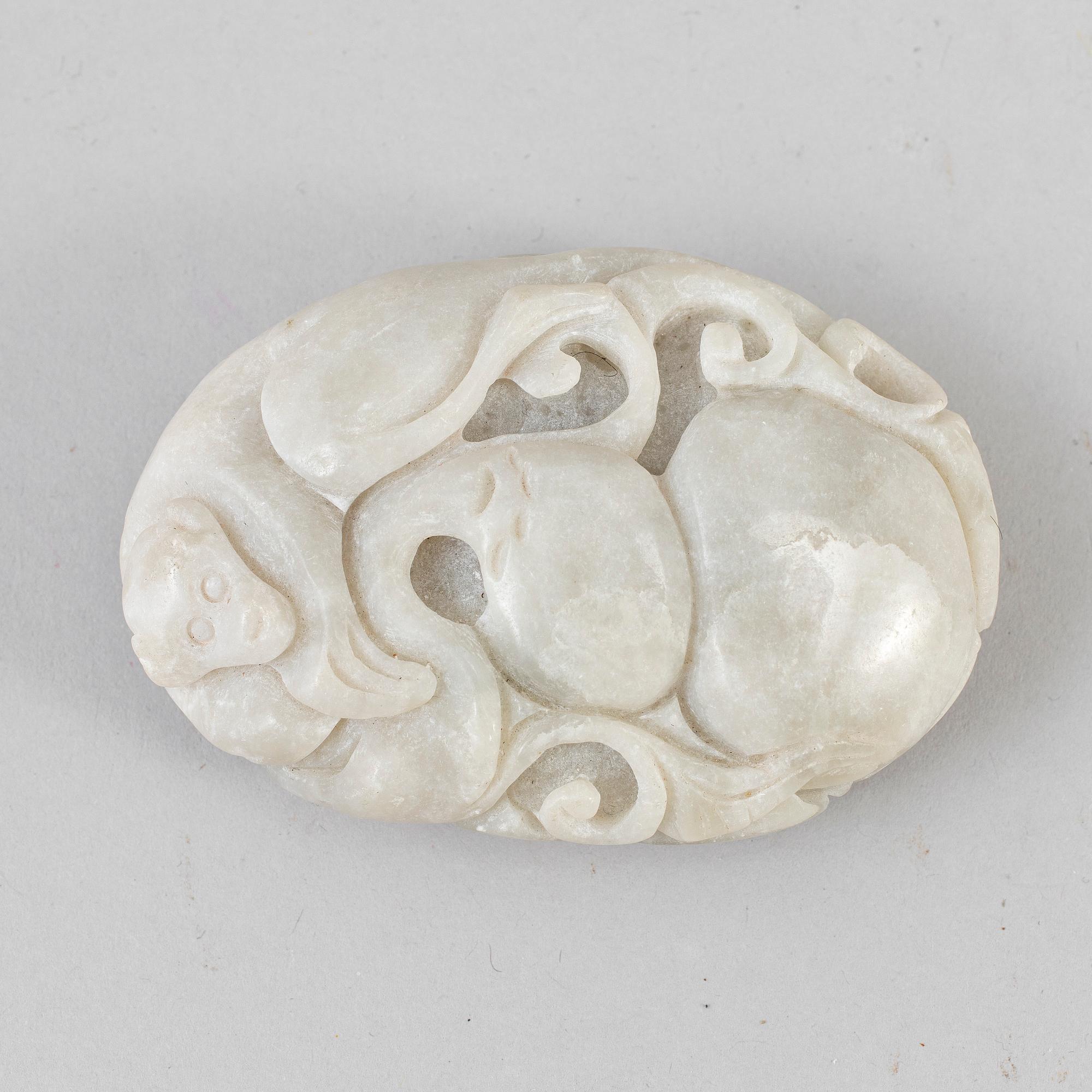 A Chinese carved sculpture of a monkey , louts and calebass fruit. 20th Century.