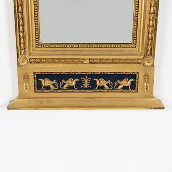 An Empire mirror, first half of the 19th Century.