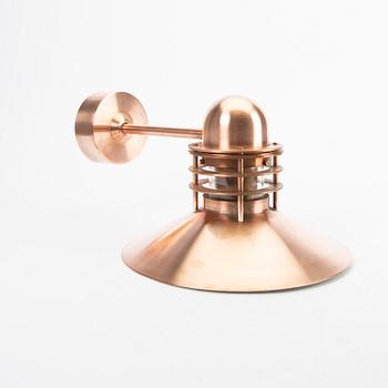 Louis Poulsen,a copper Nyhavn wall lampfrom Louis Poulsen.