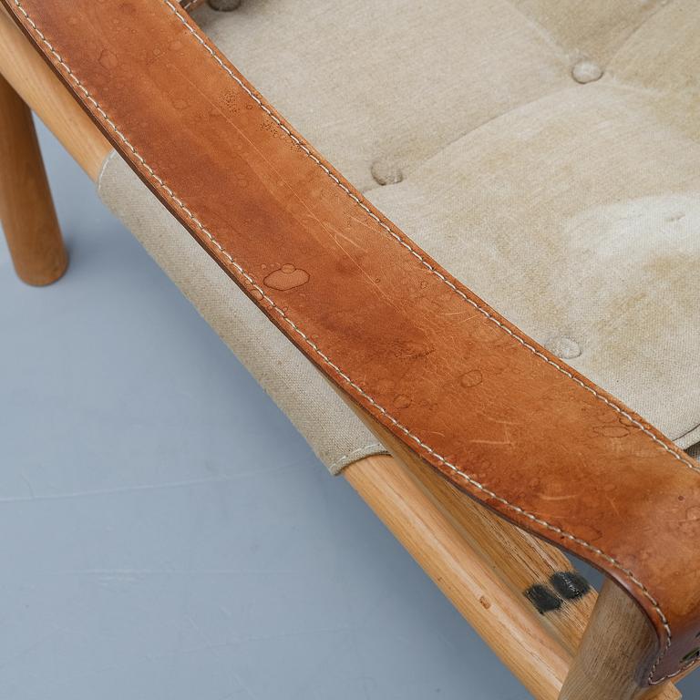 Arne Norell, a set of three "Sirocco" armchairs and two tables, Norell.