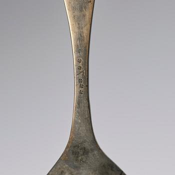 A set of three brass spoons, 18th century.