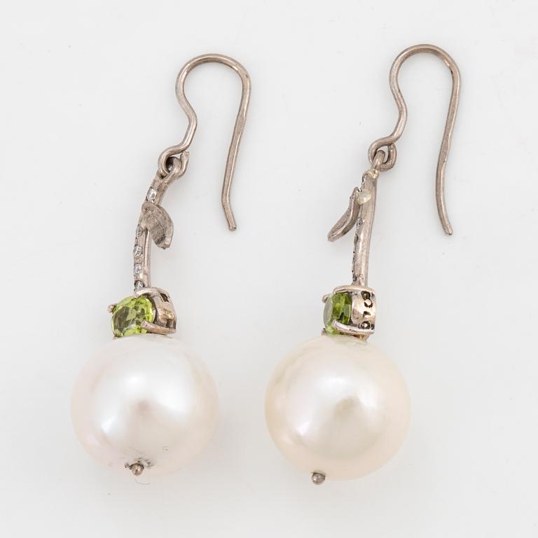 Cultured freshwater pearl, peridot and brilliant-cut diamond ring.