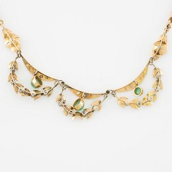 Necklace and bracelet in with floral motif set with cabochon-cut emeralds and rose-cut diamonds.