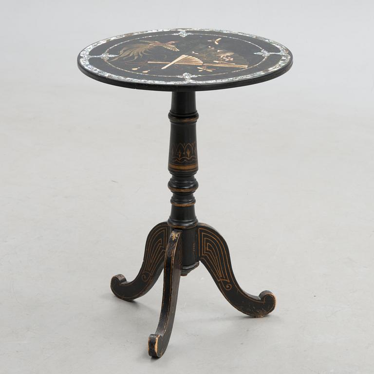 A 20th century Chinese tilt top table.