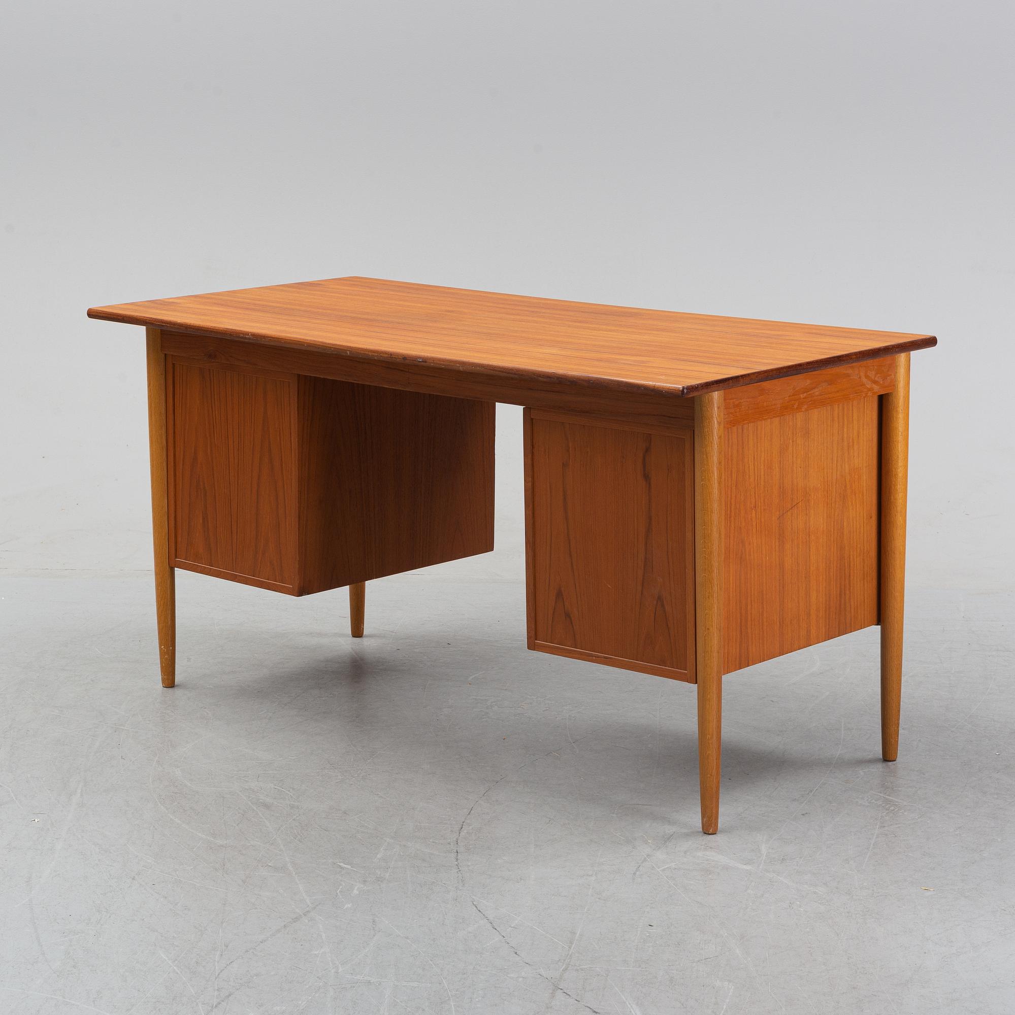 A 1950/60's oak and teak writing desk.