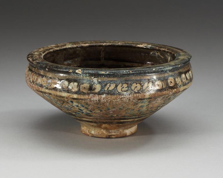 BOWL, pottery. Decoration in black, white and blue. Persia 14th century, probably Sultanabad.