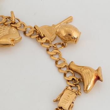 18K gold charm bracelet.