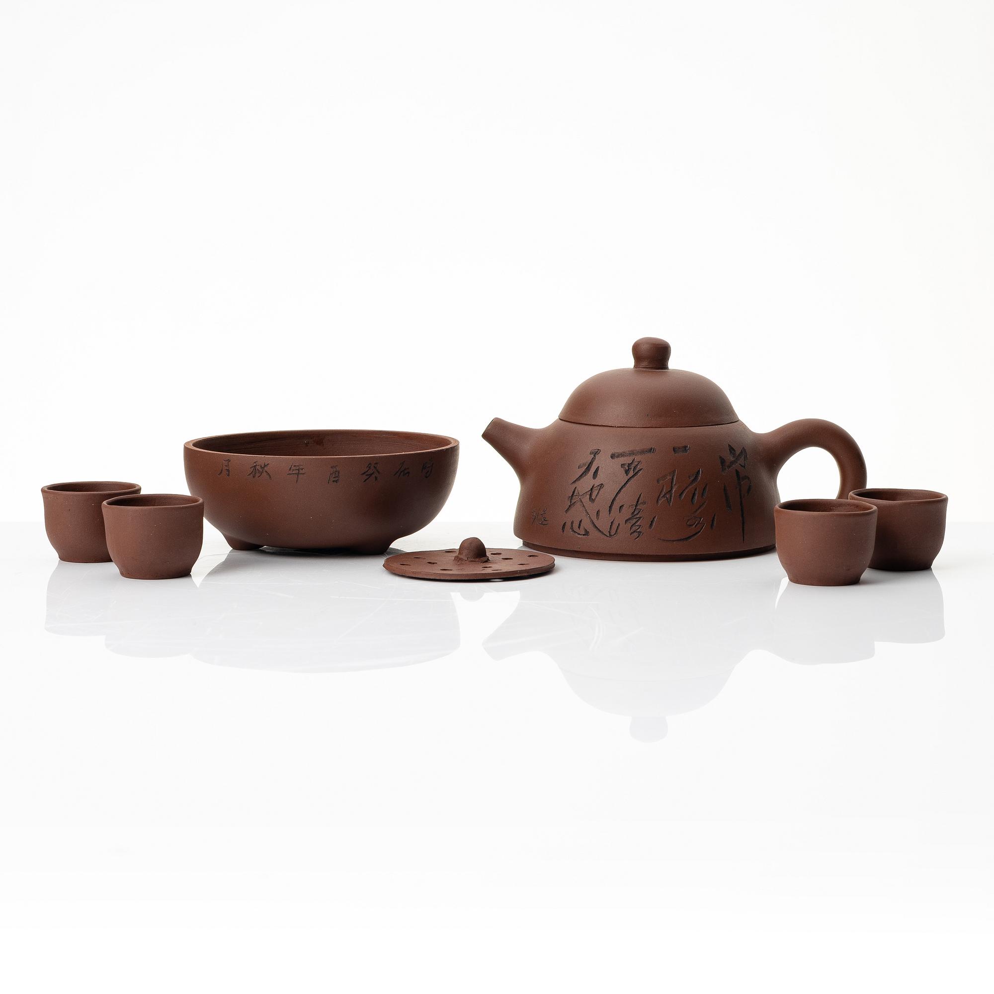 Wu Quan Xiang, A Chinese yixing teapot and a bowl with sieve and four cups, 1980s.