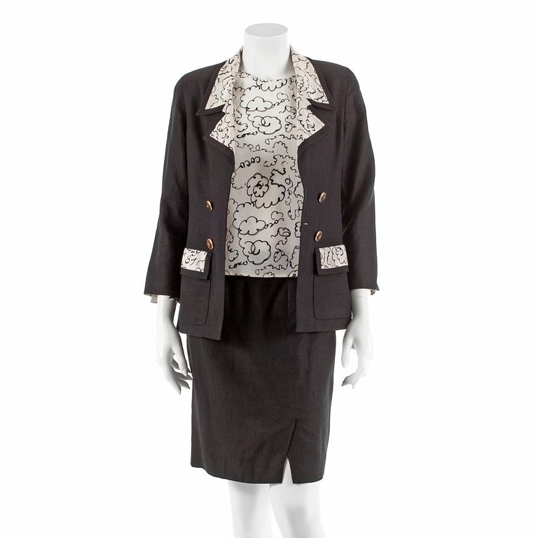 CHANEL, a three-piece suit consisting of jacket, top and skirt.