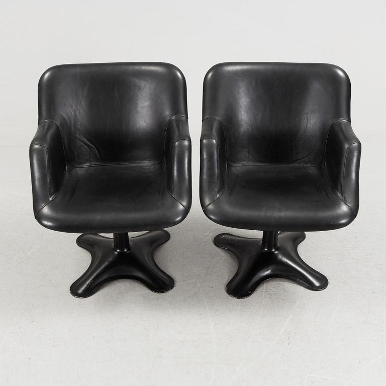 A PAIR OF BLACK YRJÖ KUKKAPURO "417 A" SWIVEL ARMCHAIRS, Haimi, Finland, 1960/70's. Labelled underneath.