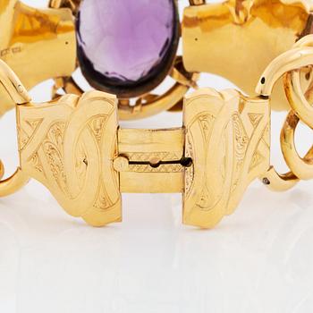 Armband 18K guld med en fasetteslipad ametist, G Möllenborg.