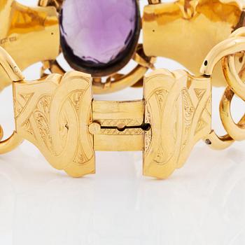 An 18K gold bracelet set with a faceted amethyst, by G Möllenborg.