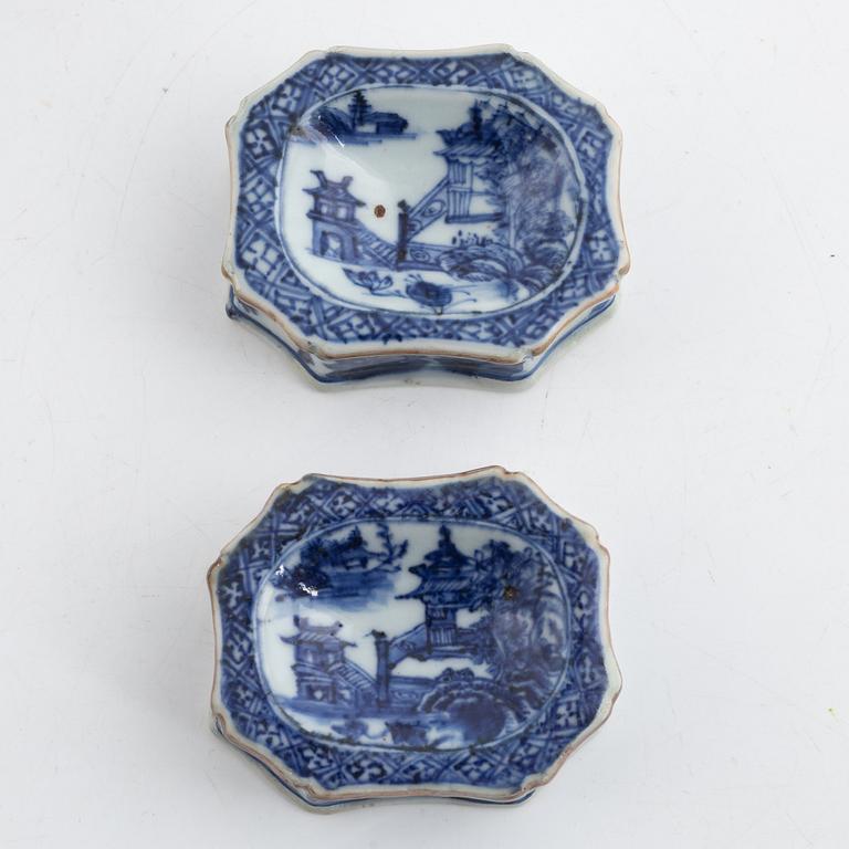 Two Chinese blue and white porcelain sauce boats and a pair of salts, also three small dishes, Qing dynasty, 18th centur.