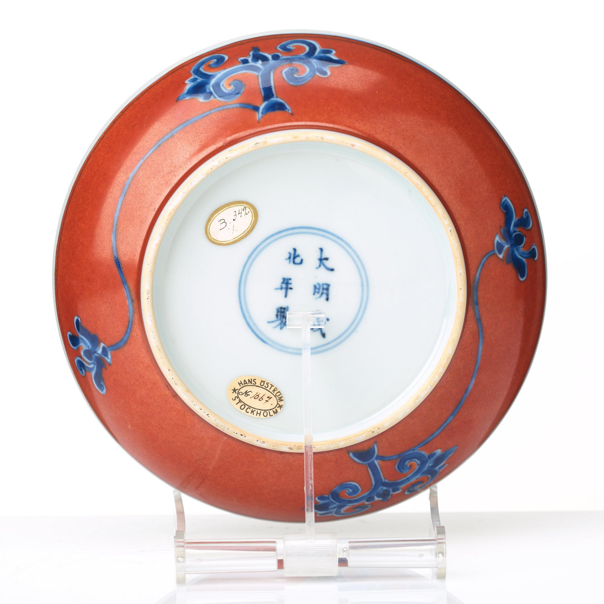 A red glazed dish, 17th Century with Chenghua mark.