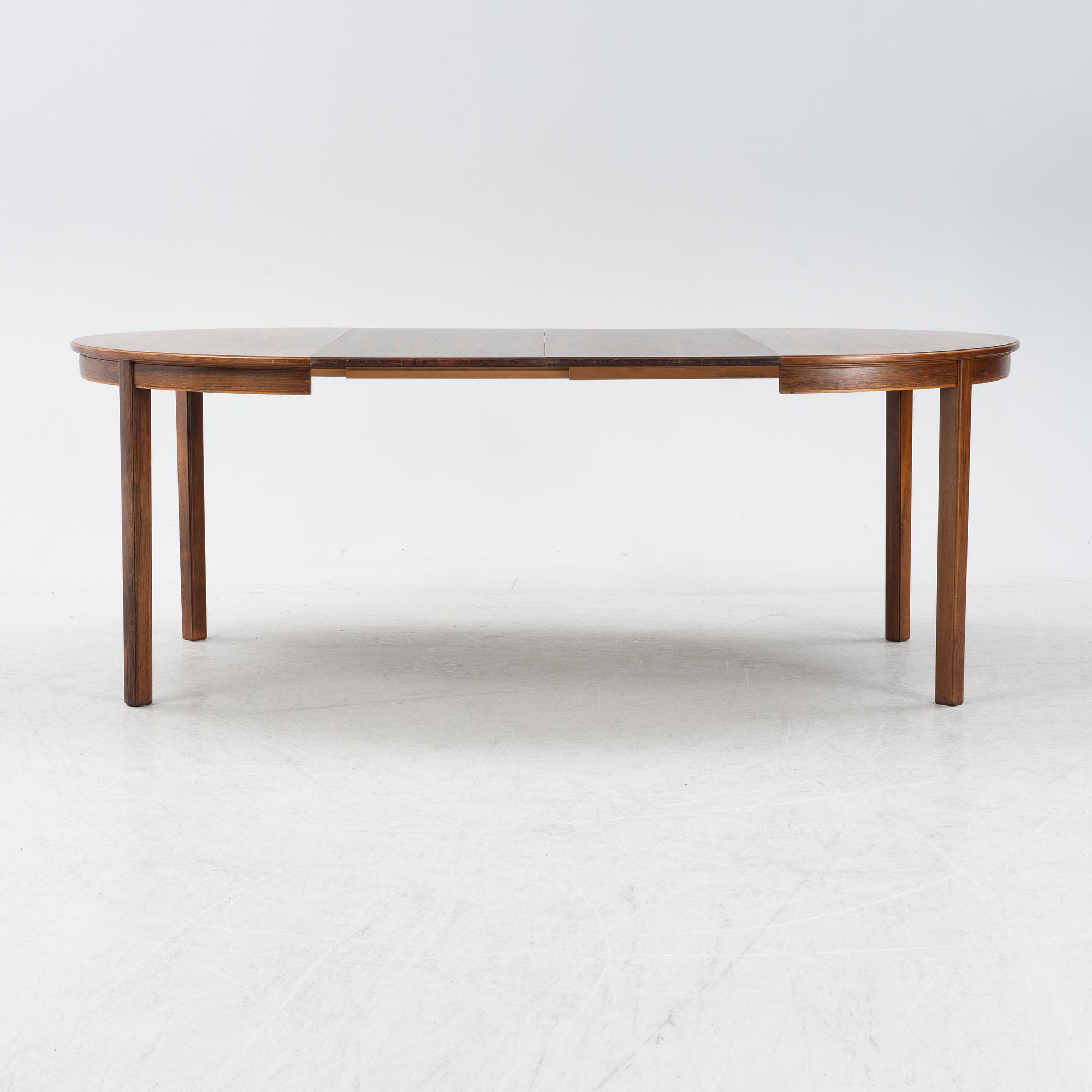 A 1960's/70's rosewood veneered dining group.