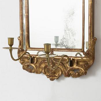 A pair of Swedish rococo two-light girandole mirrors, later part 18th century.