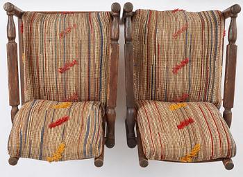 Axel Einar Hjorth, a pair of stained pine "Sandhamn" easy chairs, Nordiska Kompaniet, Sweden, 1929.