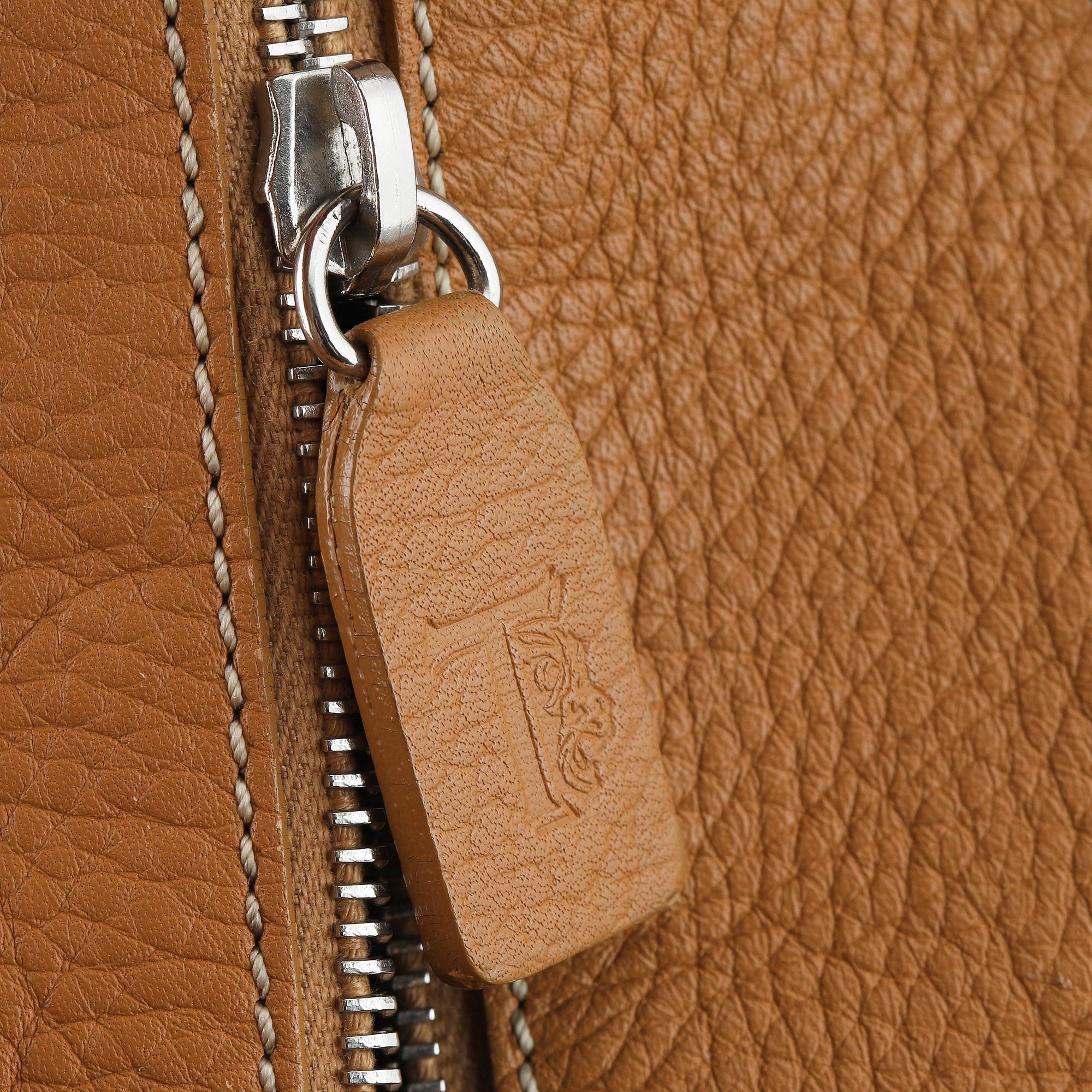 TOD'S, a tan leather bag.