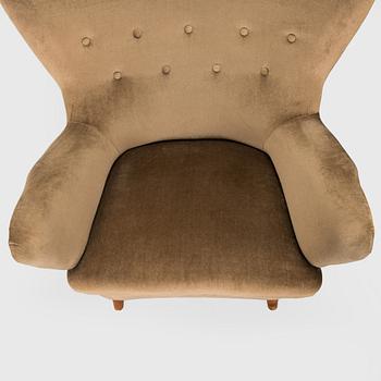 A pair of mid-20th century armchairs.