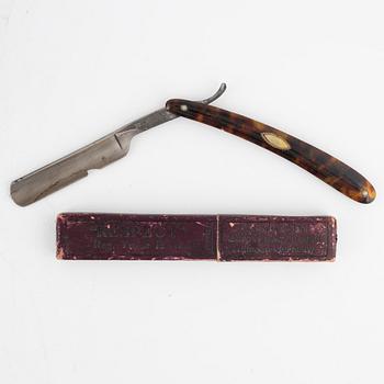 An early 19th century mahogny-veneered box for shaving utensils.