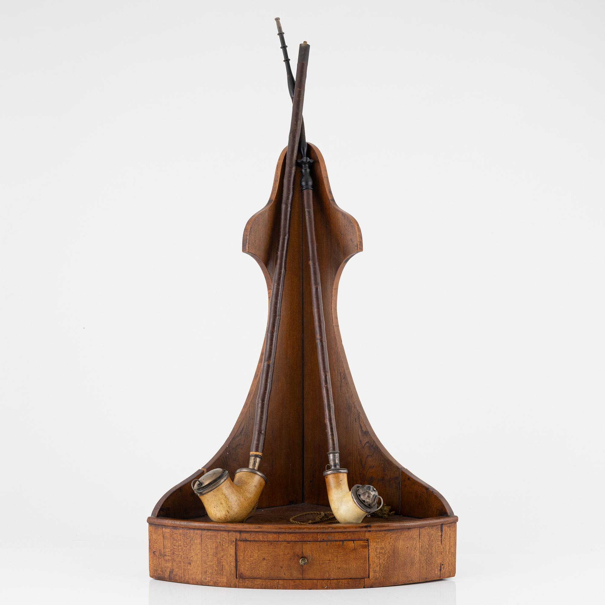 A pipe stand and two pipes, second half of the 19th century.